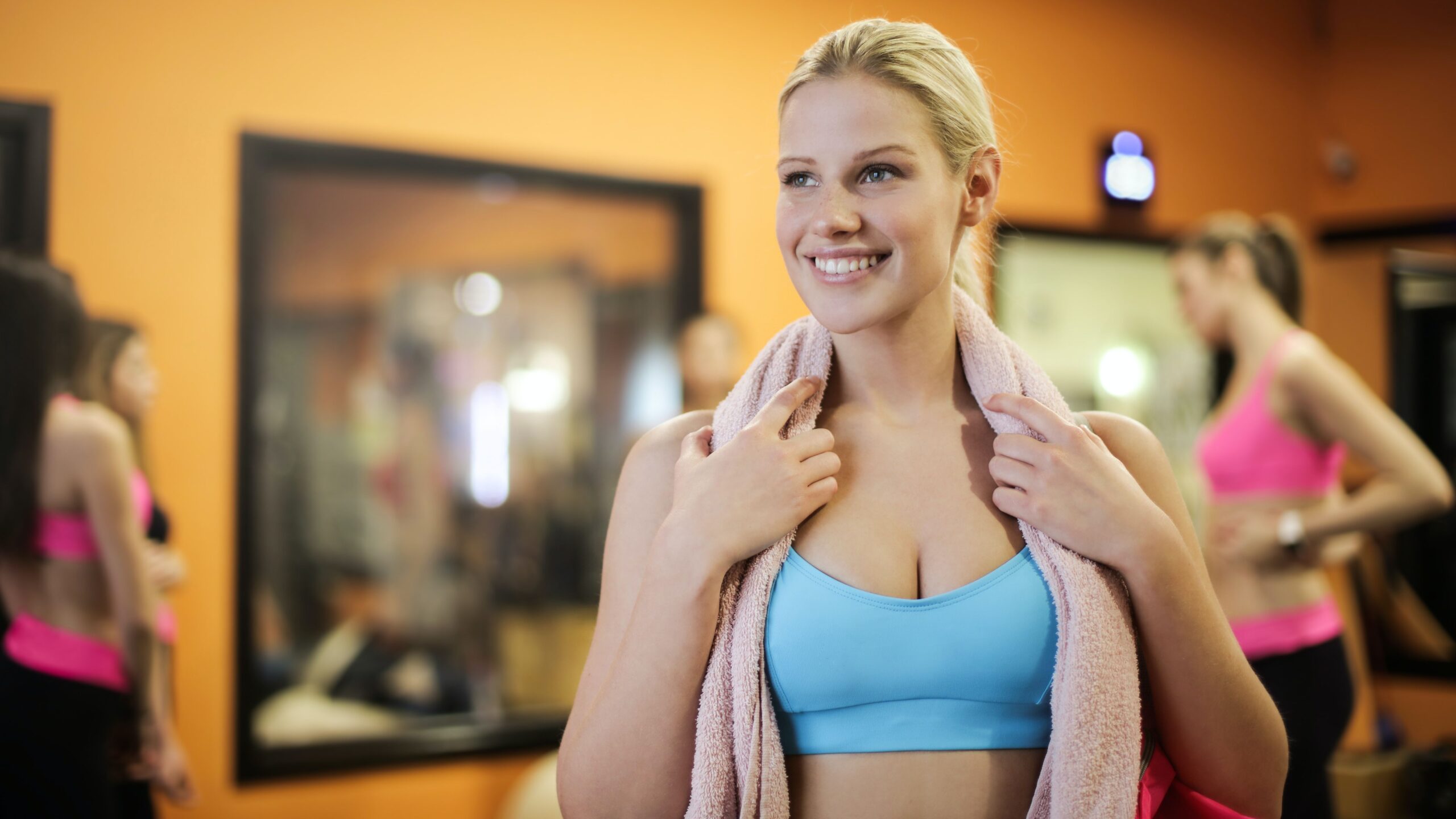 Blond woman with sport blue bra doing fitness