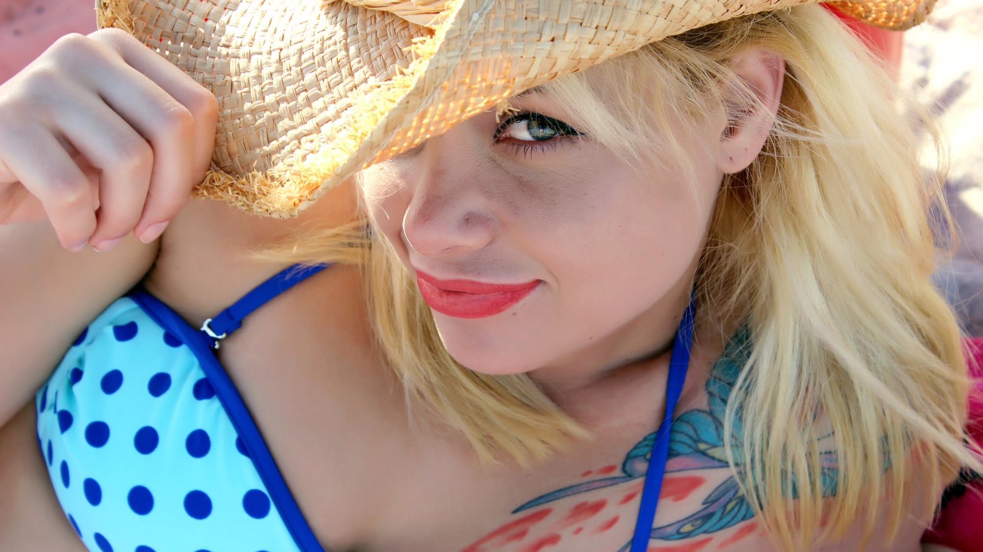 Woman sunbathing in blue swimming suit
